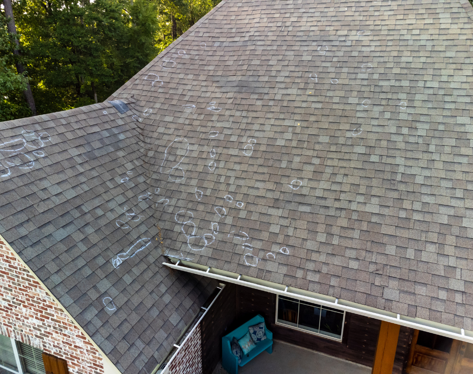 Hail damage on shingles inspected by Crest Roofing and Gutters